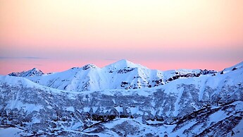 Sunrise snowshoeing in the Austrian Alps with a lot of haze in the air - Wölzer Tauern - Jochspitze
