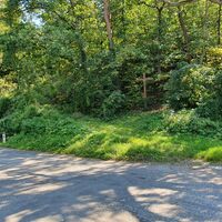 Links die Straße bei der Kurve in Plank